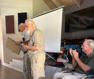 Ray Roberts (centre) presented Tim Tanser with a Certificate of appreciation for his long service to the societyTanser 